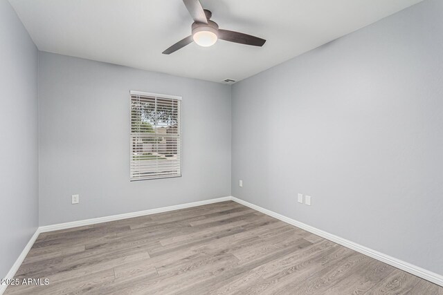 10440 E Osage Ave, Mesa, AZ 85212 - unfurnished room featuring a ceiling fan, wood finished floors, and baseboards