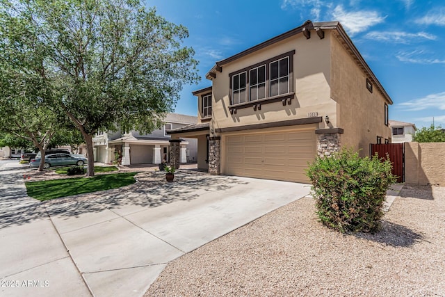 10440 E Osage Ave, Mesa, AZ 85212 - view of front of house with a garage, stucco siding, concrete driveway, and stone siding