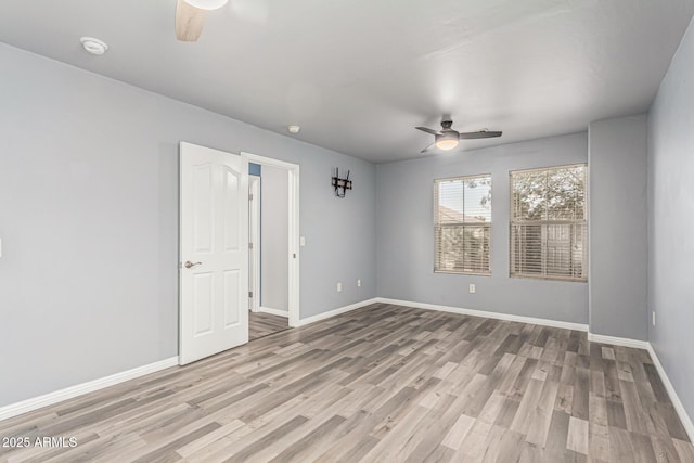 10440 E Osage Ave, Mesa, AZ 85212 - empty room featuring a ceiling fan, wood finished floors, baseboards, and a smoke detector
