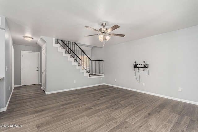 10440 E Osage Ave, Mesa, AZ 85212 - unfurnished living room featuring ceiling fan, dark wood-style flooring, stairs, and baseboards