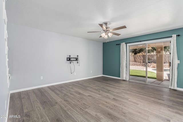 10440 E Osage Ave, Mesa, AZ 85212 - empty room featuring wood finished floors, ceiling fan, and baseboards