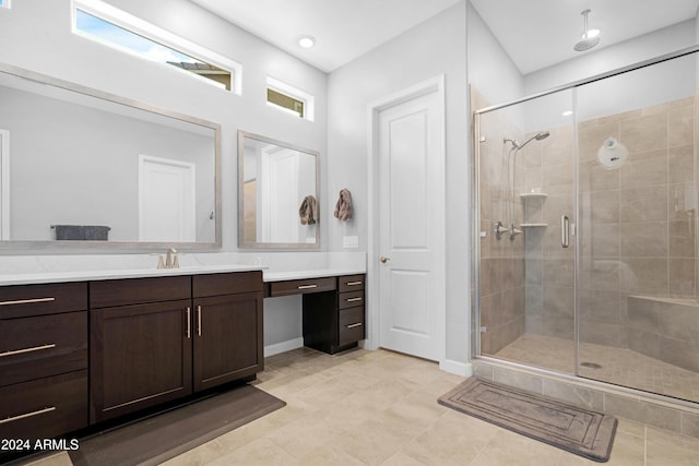 bathroom with vanity, an enclosed shower, and tile patterned flooring