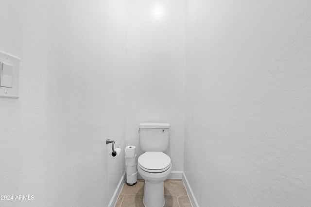 bathroom with tile patterned floors and toilet