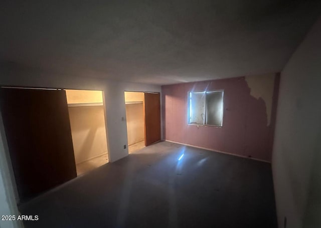 bedroom featuring concrete floors