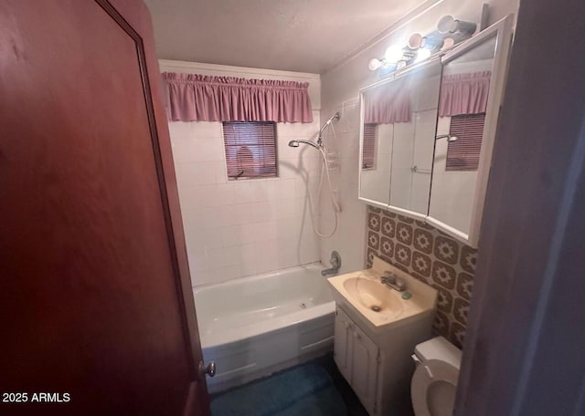 bathroom with vanity, toilet, and shower / washtub combination