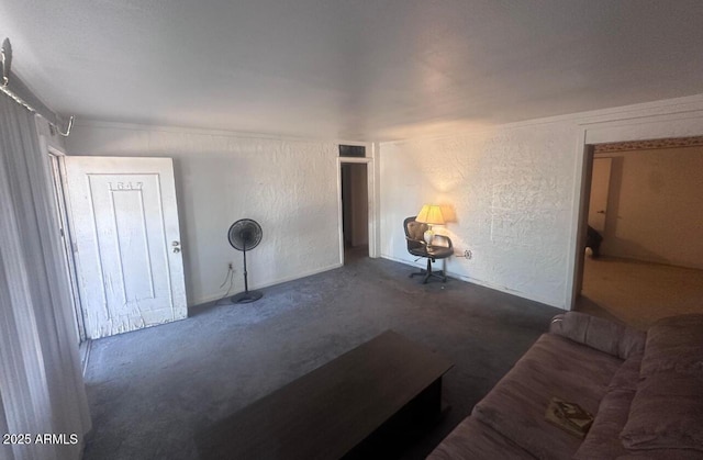 unfurnished living room featuring concrete floors and a textured wall