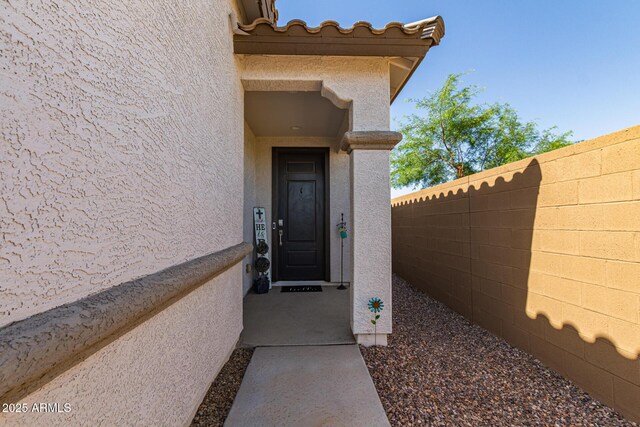 16750 W Evergreen Rd, Waddell, AZ 85355 - doorway to property with stucco siding