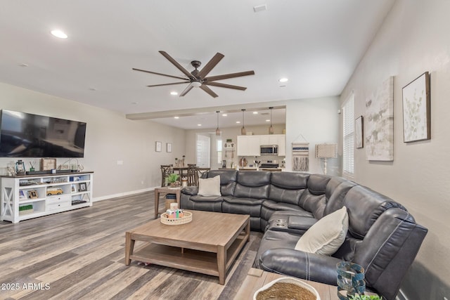 16750 W Evergreen Rd, Waddell, AZ 85355 - living room with a ceiling fan, wood finished floors, recessed lighting, and baseboards