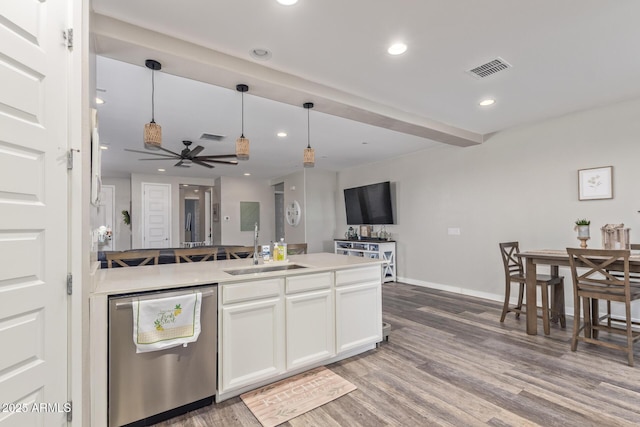 16750 W Evergreen Rd, Waddell, AZ 85355 - kitchen featuring stainless steel dishwasher, a sink, wood finished floors, open floor plan, and recessed lighting