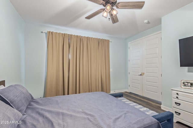 16750 W Evergreen Rd, Waddell, AZ 85355 - bedroom with dark wood finished floors, baseboards, and a ceiling fan