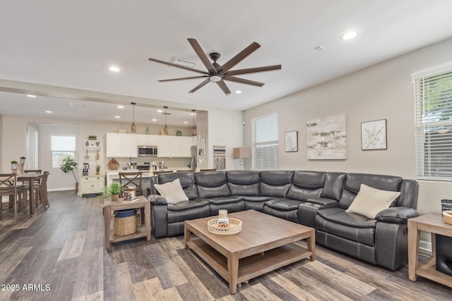 16750 W Evergreen Rd, Waddell, AZ 85355 - living area featuring ceiling fan, dark wood-type flooring, recessed lighting, and plenty of natural light