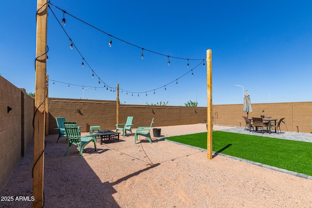 16750 W Evergreen Rd, Waddell, AZ 85355 - view of patio / terrace featuring a fire pit