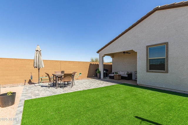 16750 W Evergreen Rd, Waddell, AZ 85355 - view of yard featuring an outdoor living space, a ceiling fan, and a patio