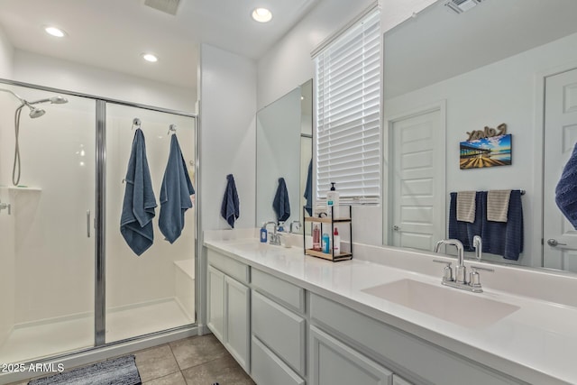 16750 W Evergreen Rd, Waddell, AZ 85355 - full bathroom featuring a shower stall, tile patterned floors, double vanity, and recessed lighting