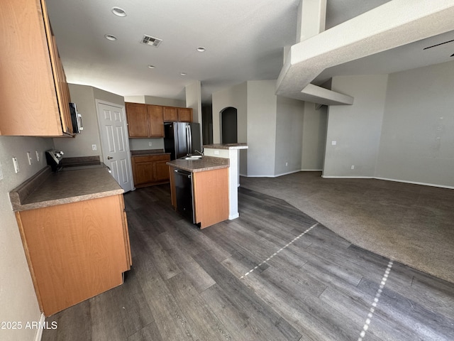 kitchen featuring a center island, dark hardwood / wood-style flooring, and stainless steel appliances