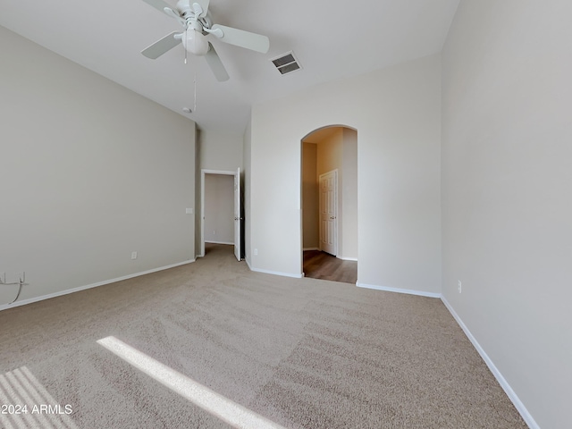 spare room featuring carpet flooring and ceiling fan