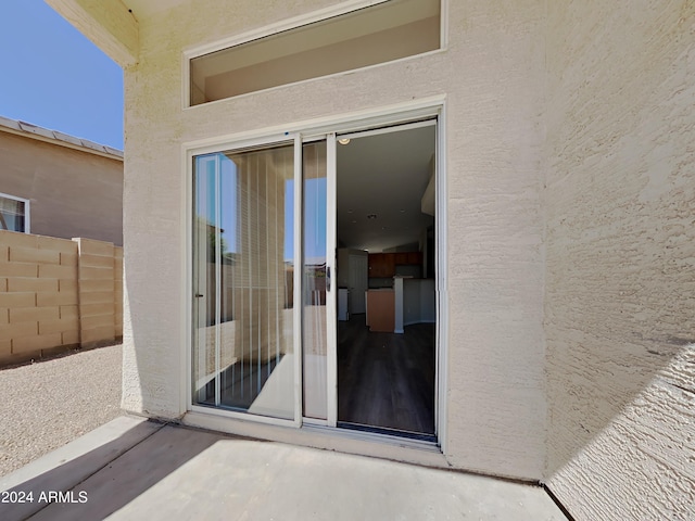 doorway to property featuring a patio