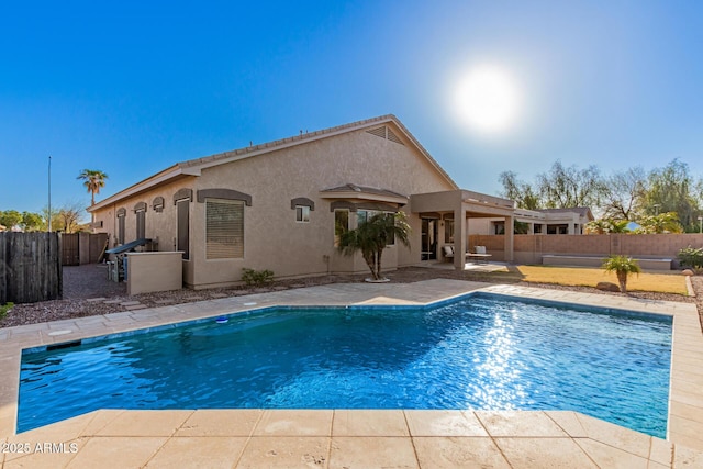 view of pool with a fenced in pool, a patio, and a fenced backyard