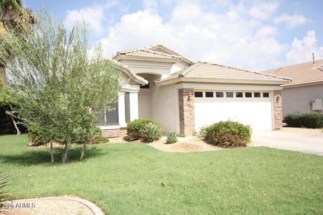 mediterranean / spanish-style house with stone siding, a tile roof, concrete driveway, a garage, and stucco siding