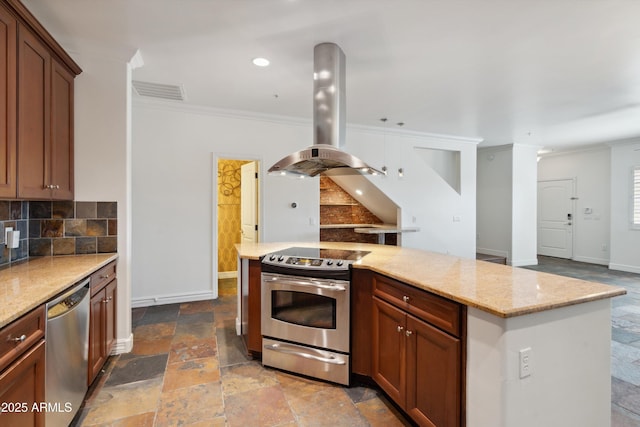 kitchen featuring crown molding, appliances with stainless steel finishes, island exhaust hood, light stone countertops, and decorative backsplash