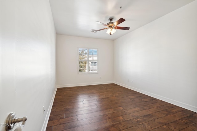 unfurnished room featuring ceiling fan and dark hardwood / wood-style flooring