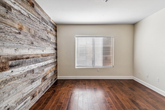 spare room featuring dark hardwood / wood-style flooring