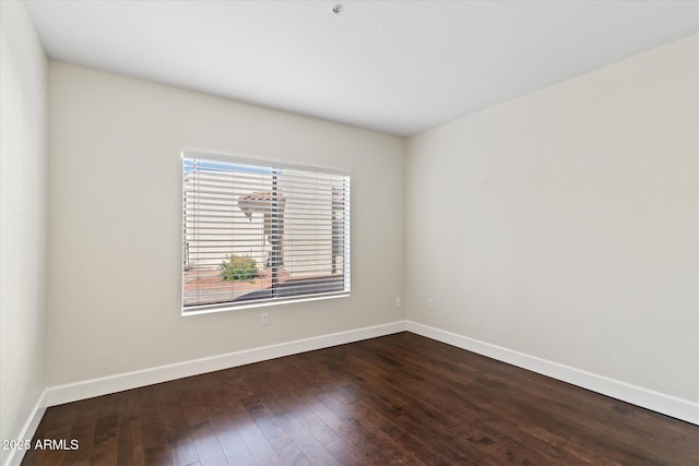 spare room with hardwood / wood-style floors