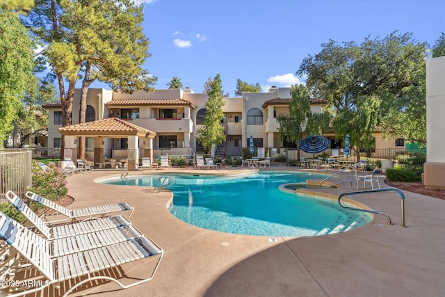 view of swimming pool with a patio