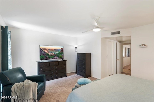 bedroom featuring light carpet and ceiling fan