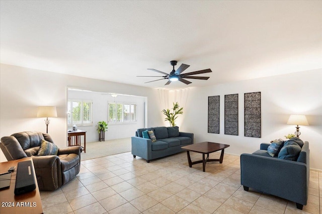 tiled living room featuring ceiling fan