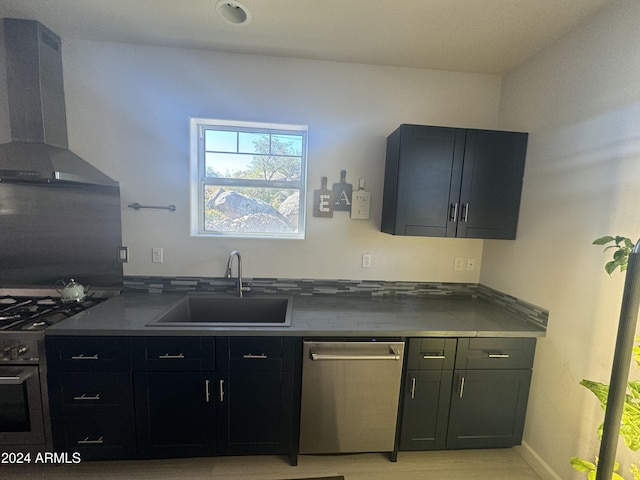 kitchen with dishwasher, black gas range, wall chimney exhaust hood, and sink