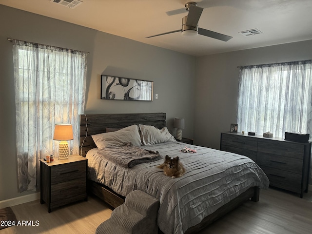 bedroom featuring ceiling fan and light hardwood / wood-style floors