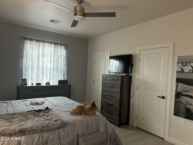 bedroom featuring ceiling fan and light hardwood / wood-style floors