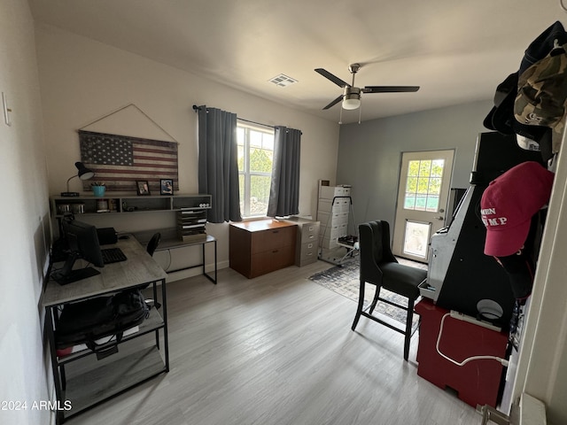 office area with light hardwood / wood-style floors and ceiling fan