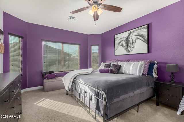 bedroom with ceiling fan and light colored carpet