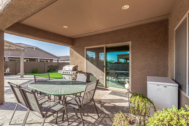 view of patio featuring a grill