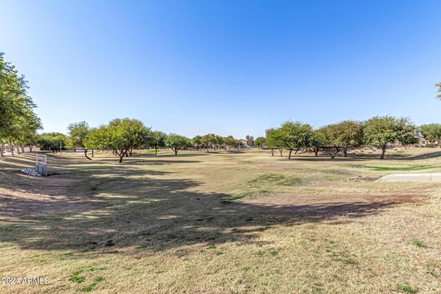 surrounding community with a rural view and a lawn