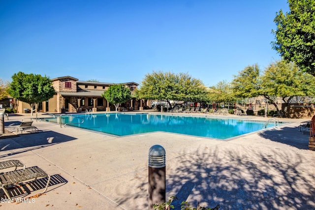 view of swimming pool with a patio area