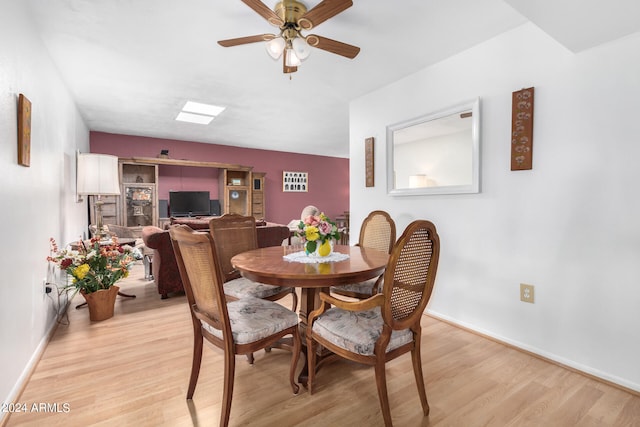 dining area featuring ceiling fan and light hardwood / wood-style flooring