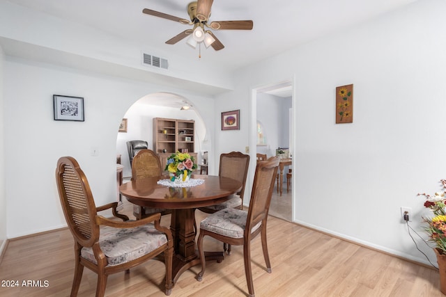 dining room featuring light hardwood / wood-style flooring and ceiling fan