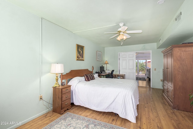 bedroom featuring ceiling fan and hardwood / wood-style flooring