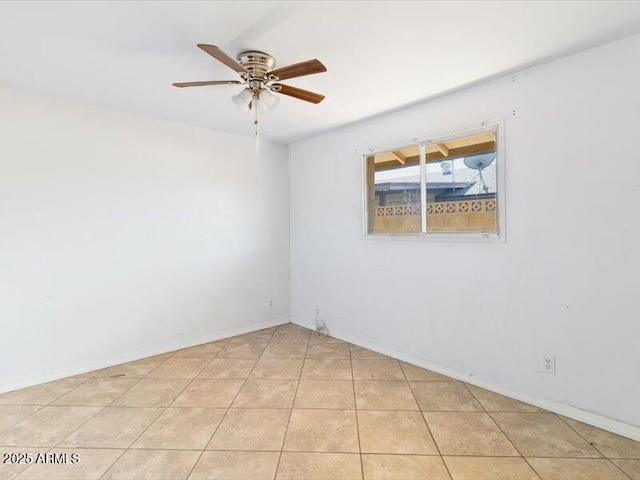 unfurnished room with light tile patterned flooring and ceiling fan