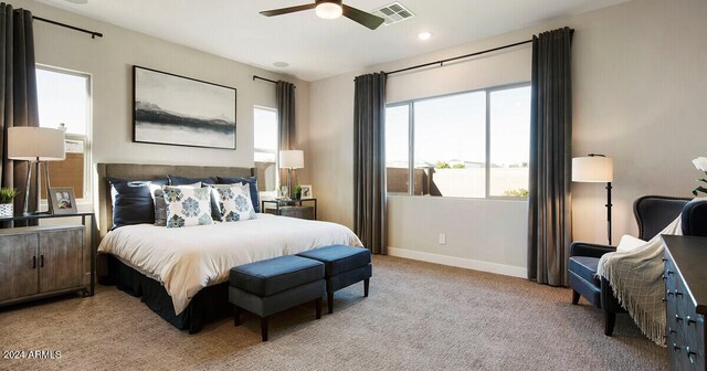 bedroom with recessed lighting, light colored carpet, a ceiling fan, baseboards, and visible vents