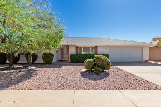 single story home featuring a garage