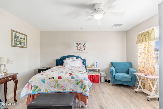 bedroom with light wood-type flooring and ceiling fan