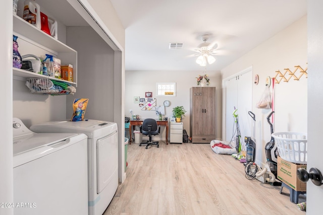 washroom with light wood-type flooring, washer and dryer, and ceiling fan