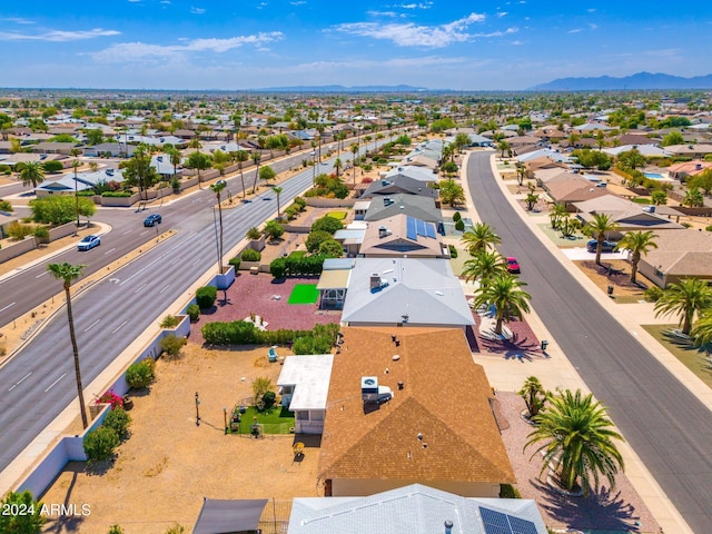 birds eye view of property with a mountain view and a residential view