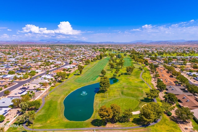 drone / aerial view with a water and mountain view