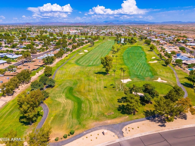 birds eye view of property with a mountain view and golf course view