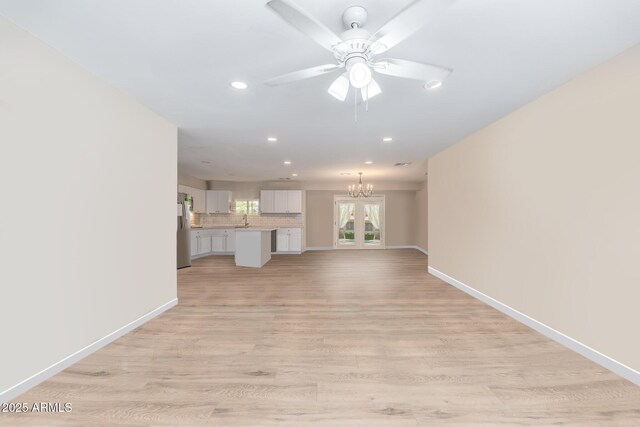 living room featuring ceiling fan and hardwood / wood-style flooring